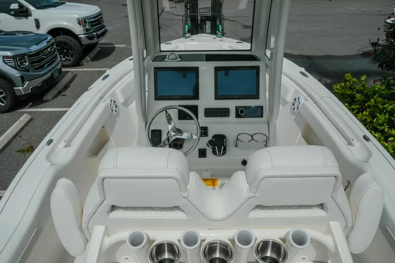 Slide: The Image of Interior view of 2026 Key West 239 FSR boat with modern dashboard and seating. - 20