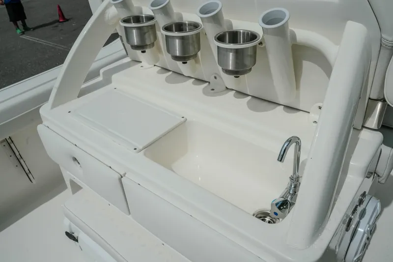 Slide: The Image of Key West 239 FSR 2026 boat sink with cup holders and faucet. - 21