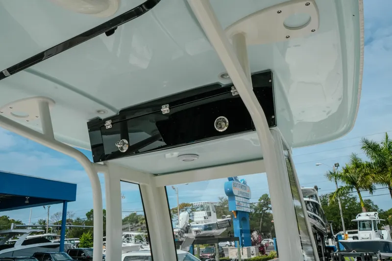 Slide: The Image of 2026 Key West 239 FSR boat interior with overhead storage and sleek design. - 26