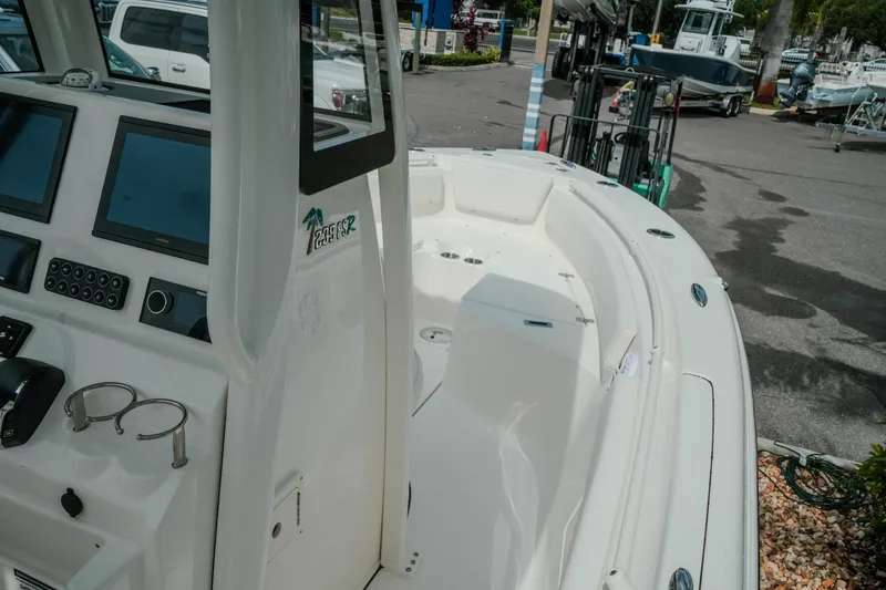 Slide: The Image of 2026 Key West 239 FSR boat interior with modern dashboard and spacious seating area. - 27
