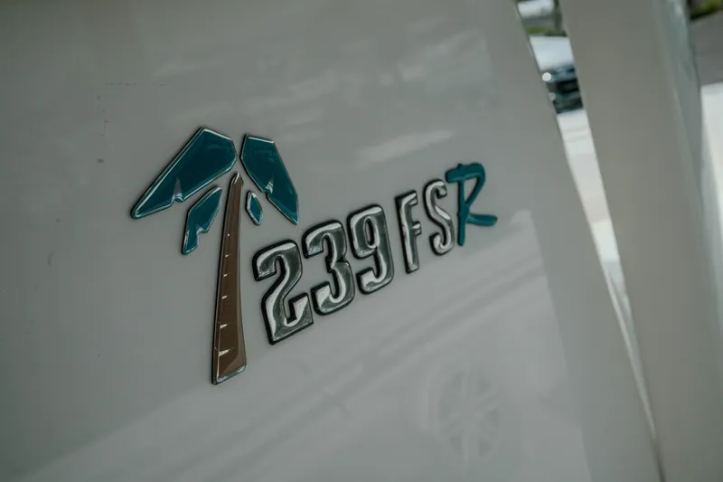 Slide: The Image of Key West 239 FSR 2026 model emblem on boat exterior. - 28