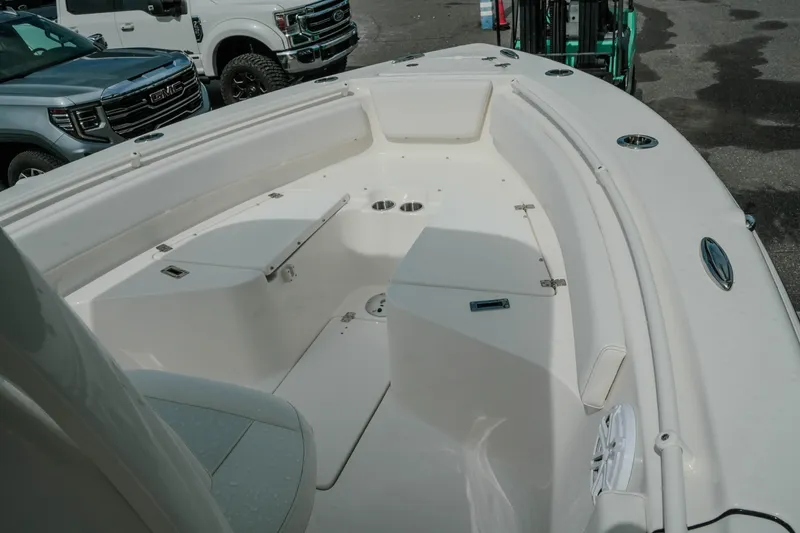 Slide: The Image of 2026 Key West 239 FSR boat deck with seating and storage compartments. - 29