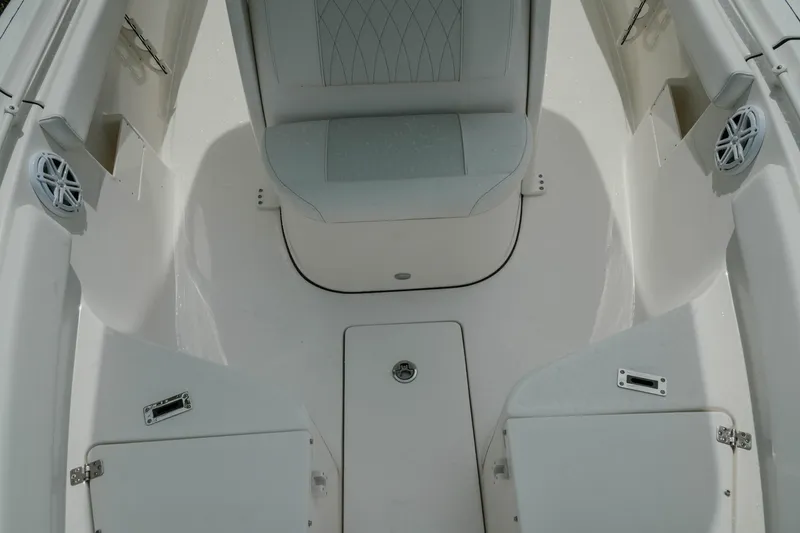 Slide: The Image of 2026 Key West 239 FSR boat interior with seating and storage compartments. - 30