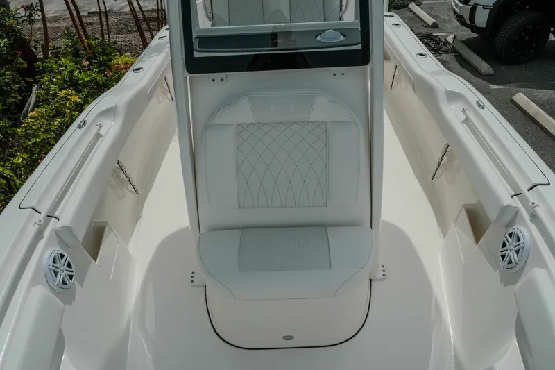 Slide: The Image of 2026 Key West 239 FSR boat interior with cushioned seating and speakers. - 31