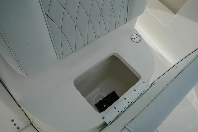 Slide: The Image of Storage compartment on 2026 Key West 239 FSR boat with cushioned seating. - 34