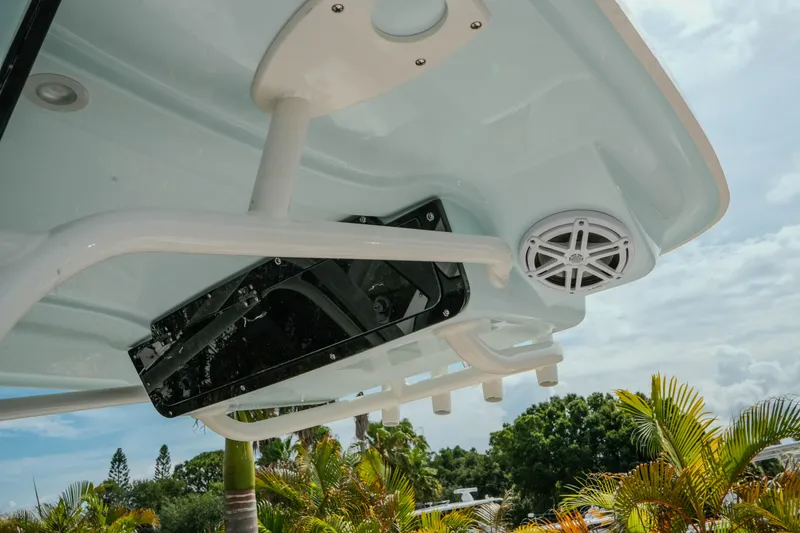 Slide: The Image of 2026 Key West 239 FSR boat roof with speaker and rod holders, tropical background. - 36