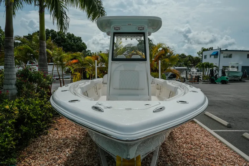 Slide: The Image of 2026 Key West 239 FSR boat displayed outdoors with palm trees in the background. - 5