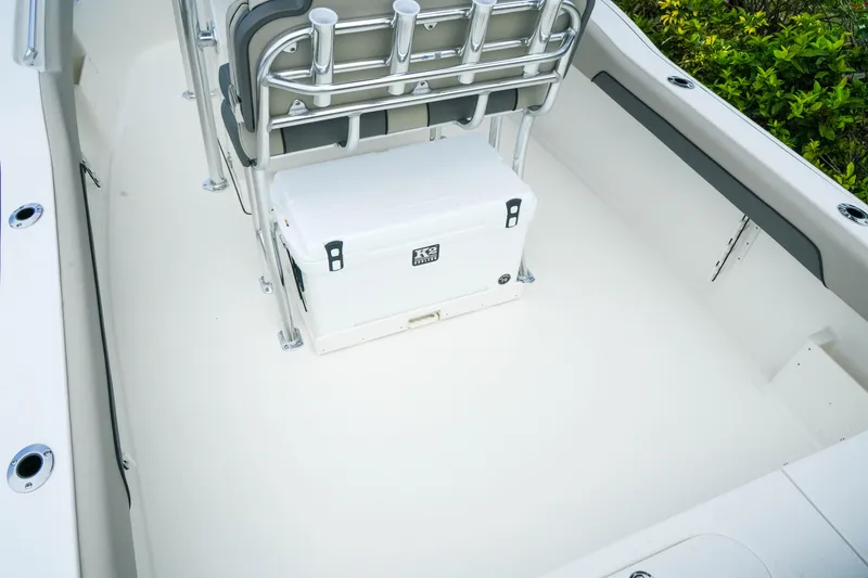 Slide: The Image of 2026 Key West 239 FS boat interior with seating and cooler. - 11