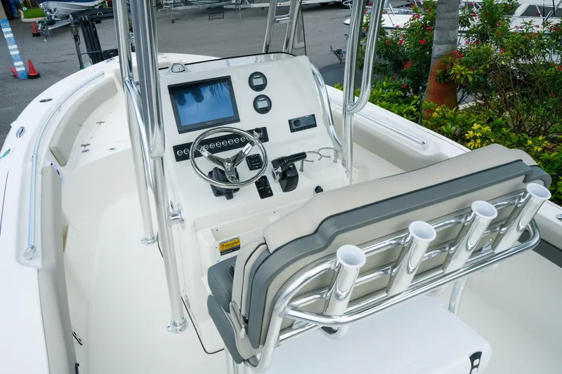 Slide: The Image of 2026 Key West 239 FS boat interior with steering console and seating. - 15
