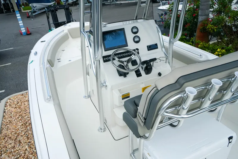 Slide: The Image of 2026 Key West 239 FS boat interior with modern console and seating. - 16