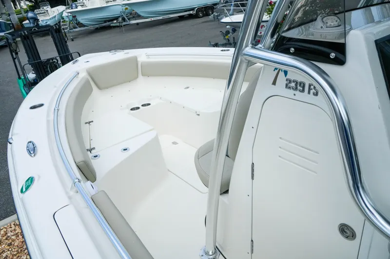 Slide: The Image of 2026 Key West 239 FS boat interior with seating and console details. - 18