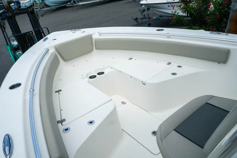 Slide: The Image of 2026 Key West 239 FS boat interior with seating and cup holders. - 19