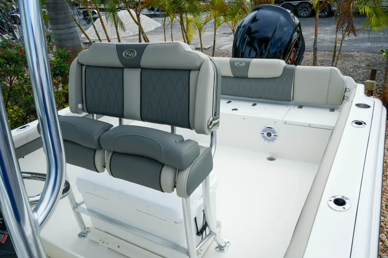 Slide: The Image of 2026 Key West 239 FS boat interior with cushioned seating and sleek design. - 20