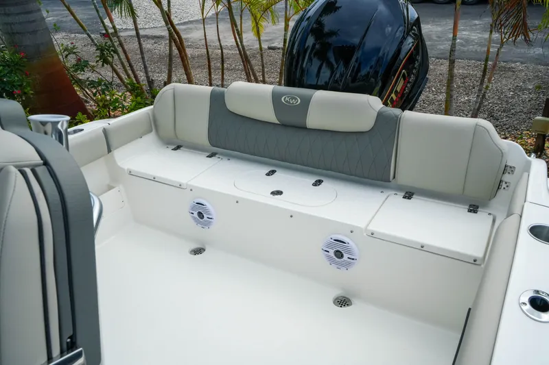 Slide: The Image of 2026 Key West 239 FS boat interior with cushioned seating and speakers. - 21