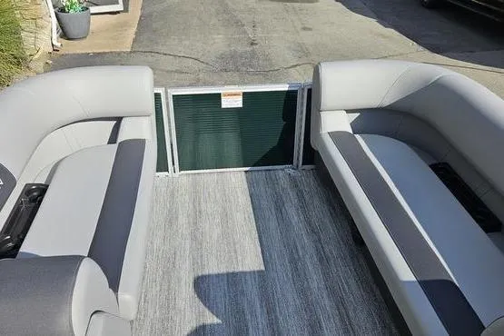 Slide: The Image of Interior of a 2026 Bennington 22 SF pontoon boat with gray seating. - 11