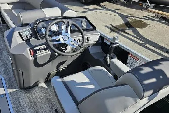 Slide: The Image of Interior view of 2026 Bennington 22 SF boat cockpit with steering wheel and controls. - 12