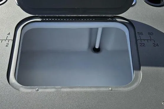 Slide: The Image of Open storage compartment on 2026 Bennington 22 SF boat, featuring measurement markings. - 14