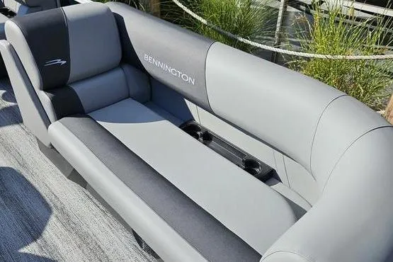 Slide: The Image of 2026 Bennington 22 SF boat seating with gray upholstery and cup holders. - 7