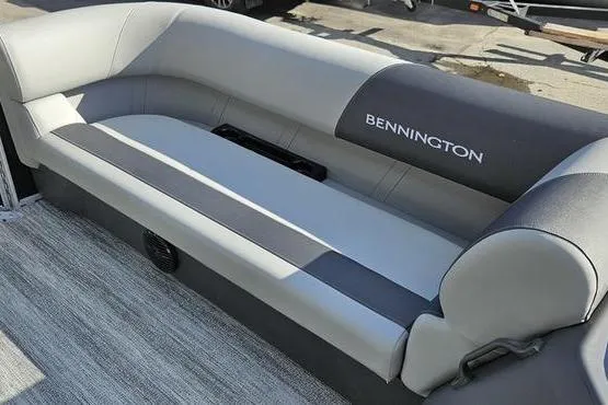 Slide: The Image of 2026 Bennington 22 SF boat interior with gray seating and logo. - 8