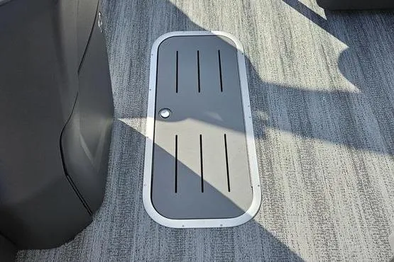 Slide: The Image of 2026 Bennington 22 SF boat floor hatch with sleek design and textured surface. - 9