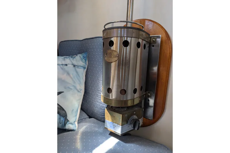 Slide: The Image of Vintage Ohlson 38 boat interior with a mounted metal heater, 1984 model. - 17
