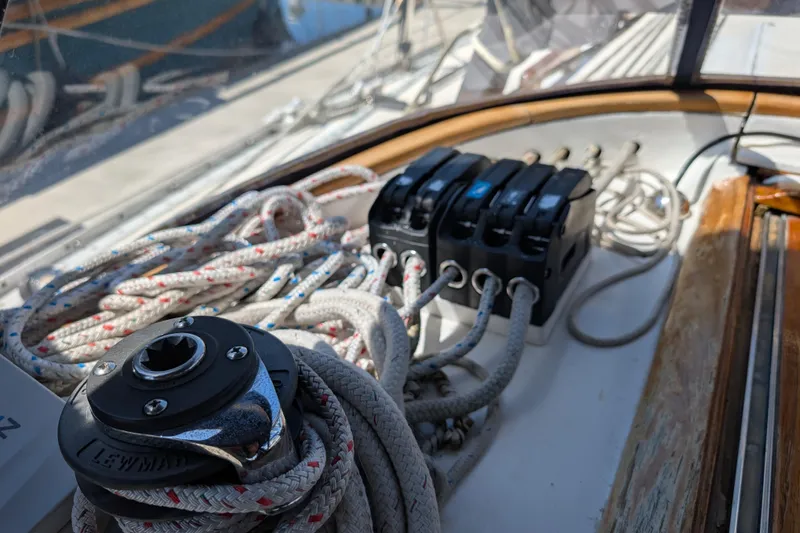 Slide: The Image of Close-up of sailing ropes and winch on a 1984 Ohlson 38 yacht deck. - 32