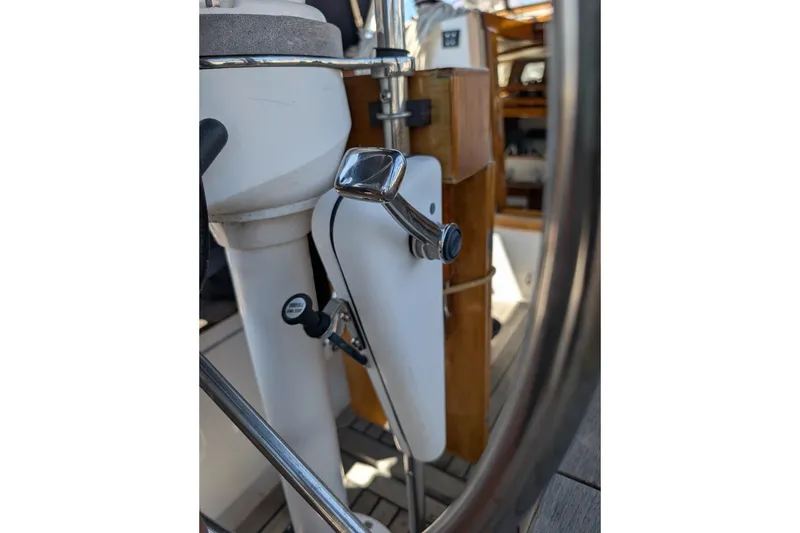 Slide: The Image of Close-up of 1984 Ohlson 38 yacht steering wheel and cockpit controls. - 36