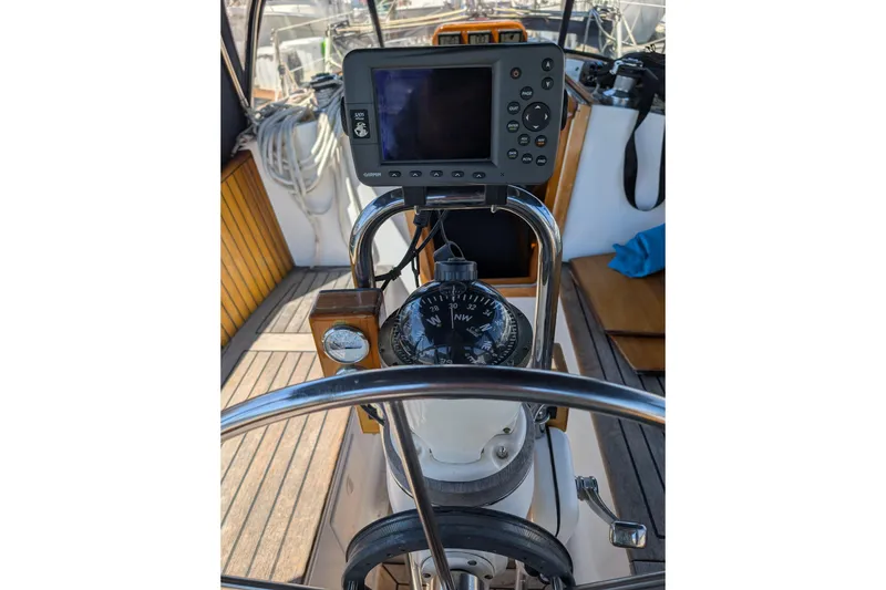 Slide: The Image of Cockpit of 1984 Ohlson 38 sailboat with compass and navigation equipment. - 38