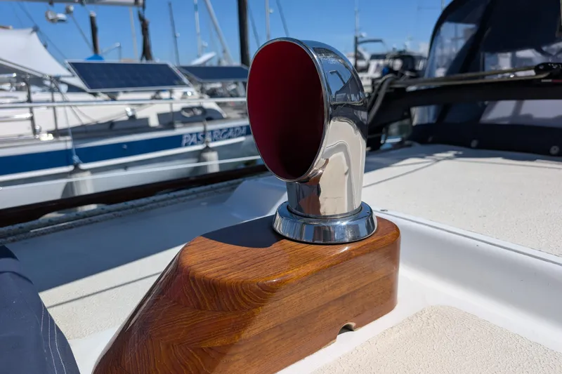 Slide: The Image of Chrome vent on 1984 Ohlson 38 yacht deck, with marina background. - 42