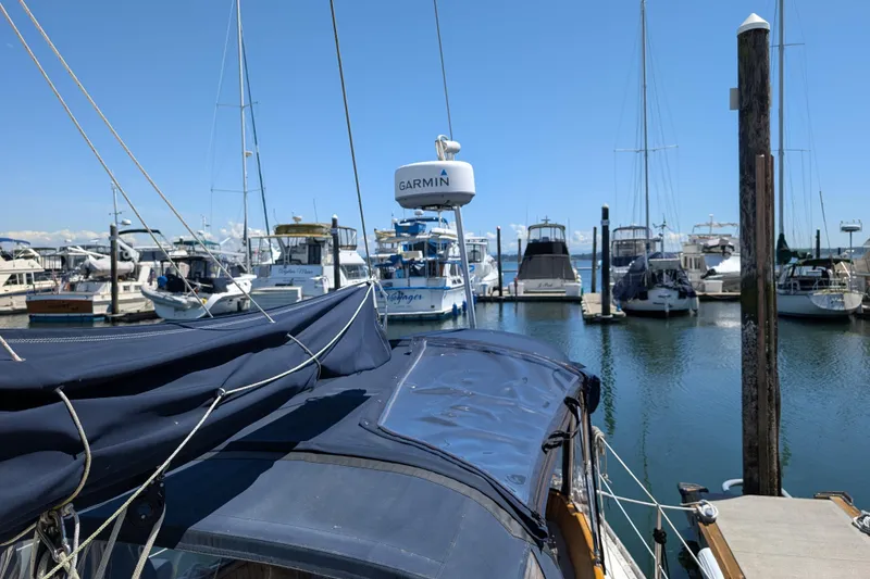 Slide: The Image of Sailboat docked in marina, Ohlson 38 model, 1984, with Garmin equipment. - 44