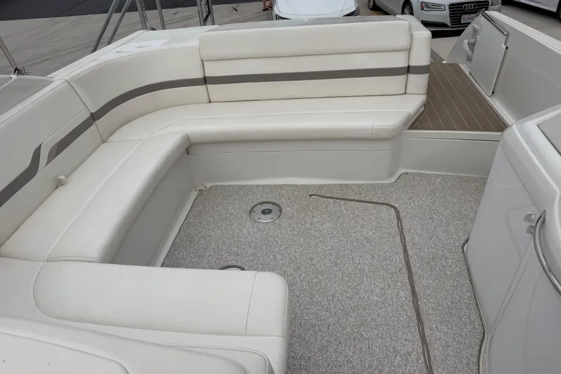 Slide: The Image of 2002 Formula 330 Sun Sport boat interior with white seating and carpeted floor. - 13