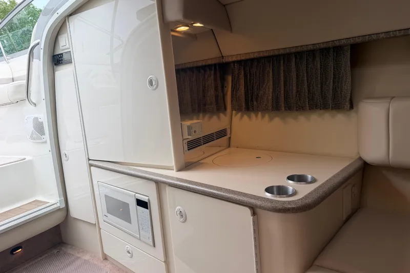 Slide: The Image of Interior of a 2002 Formula 330 Sun Sport boat with kitchenette and microwave. - 21
