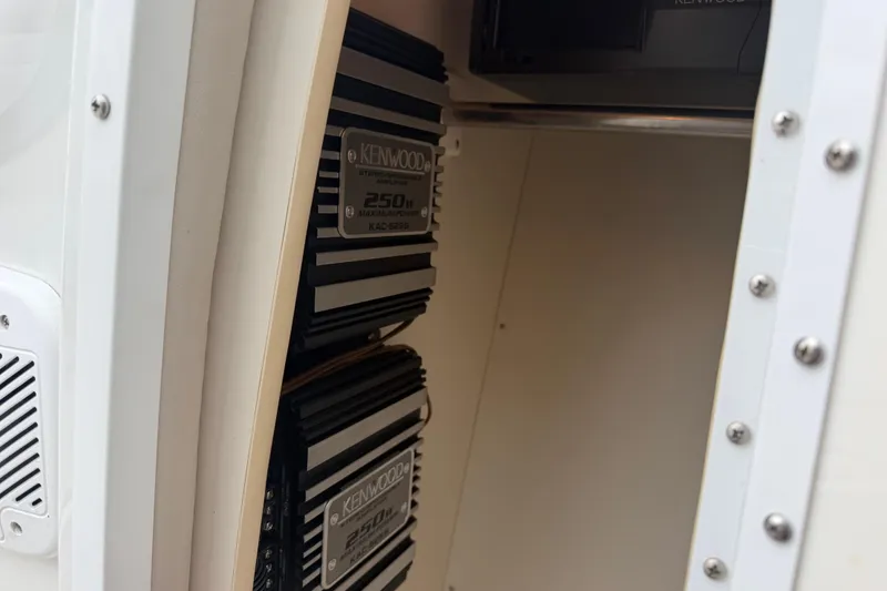 Slide: The Image of Kenwood stereo amplifiers in a 2002 Formula 330 Sun Sport boat interior. - 28