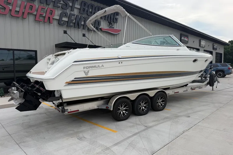 Slide: The Image of 2002 Formula 330 Sun Sport boat on trailer at dealership, side view. - 3