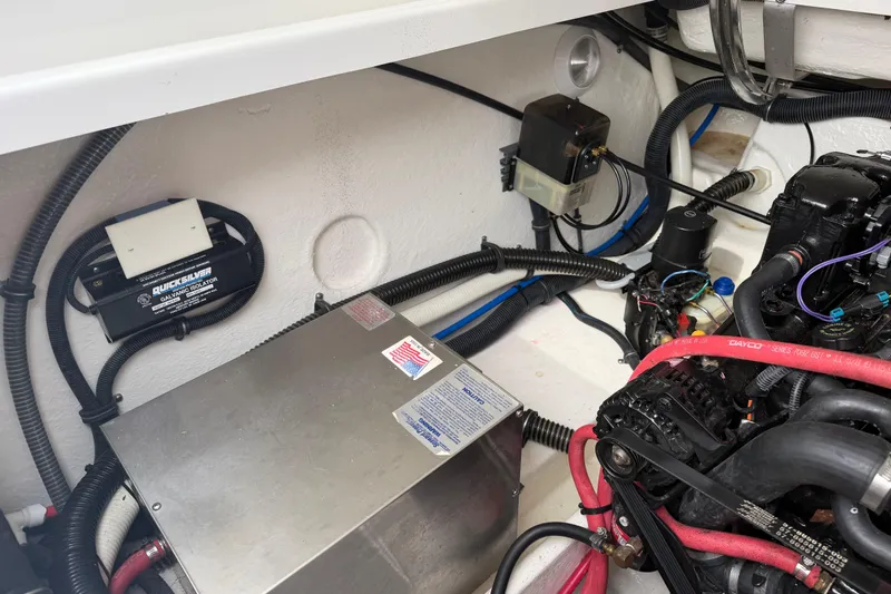 Slide: The Image of Engine compartment of a 2002 Formula 330 Sun Sport boat, showcasing wiring and components. - 31