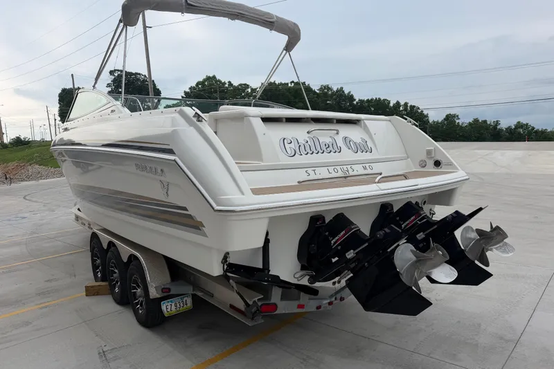 Slide: The Image of 2002 Formula 330 Sun Sport boat on trailer, rear view, with dual propellers. - 5