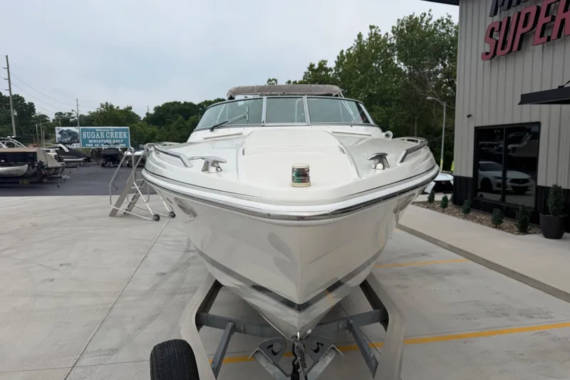 Slide: The Image of 2002 Formula 330 Sun Sport boat on trailer, parked outside dealership. - 9