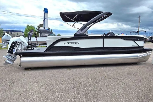 Slide: The Image of Godfrey Monaco 235 SB iMPACT 2026 pontoon boat on parking lot. - 3