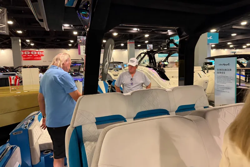 Slide: The Image of Boat show featuring 2028 Nor-Tech 42 Eleven with attendees discussing features. - 12