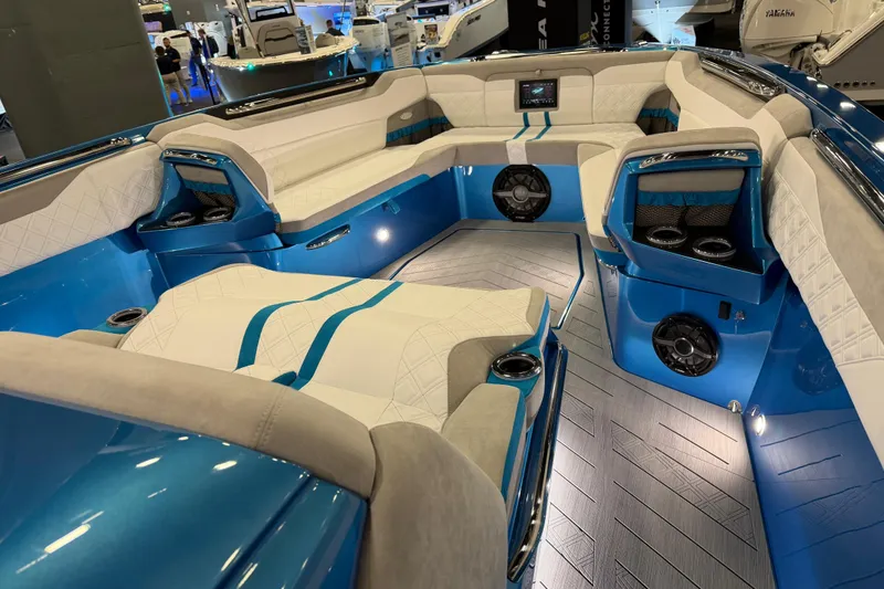 Slide: The Image of Luxurious interior of 2028 Nor-Tech 42 Eleven boat with blue and white seating. - 14