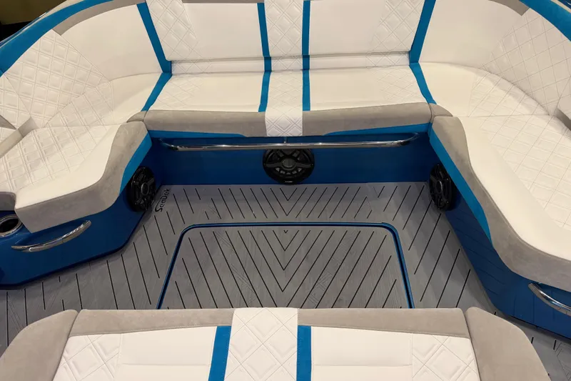 Slide: The Image of Luxurious seating area on 2028 Nor-Tech 42 Eleven boat with blue and white upholstery. - 8