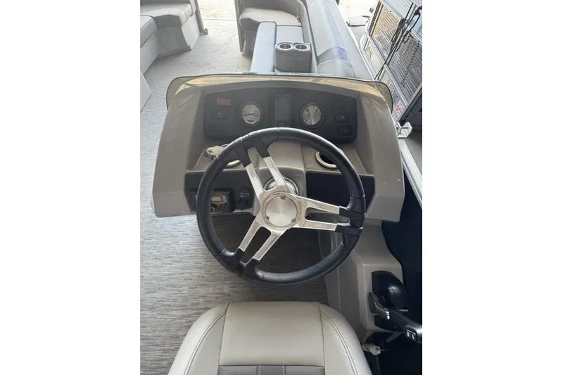 Slide: The Image of 2022 Bennington 22 SLX boat steering console with gauges and controls. - 10