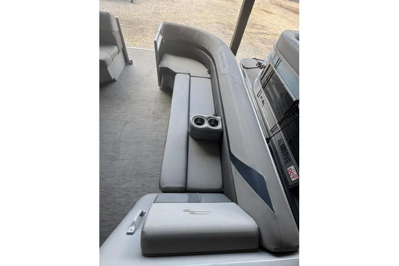 Slide: The Image of 2022 Bennington 22 SLX pontoon boat with gray seating and cup holders. - 6