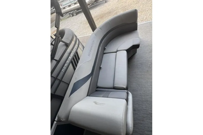 Slide: The Image of 2022 Bennington 22 SLX boat interior with sleek gray seating. - 7