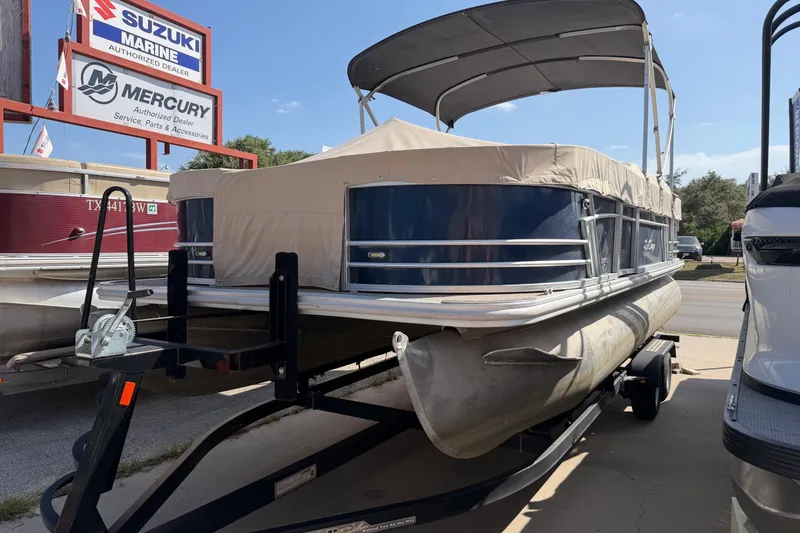 Slide: The Image of 2019 SunChaser Geneva Cruise 20 4.0 Fish pontoon boat on trailer at dealership. - 1