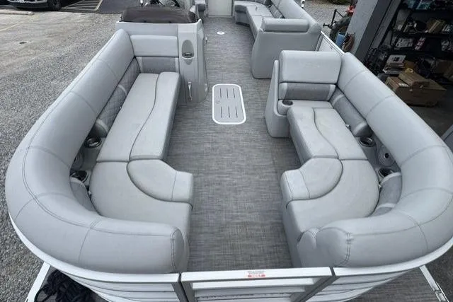 Slide: The Image of 2021 Bennington 24 LRSC pontoon boat with spacious gray seating and modern design. - 3