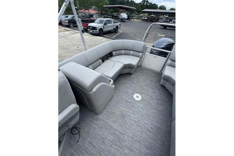 Slide: The Image of Interior of a 2021 Bennington 24 LRSC pontoon boat with gray seating and flooring. - 6