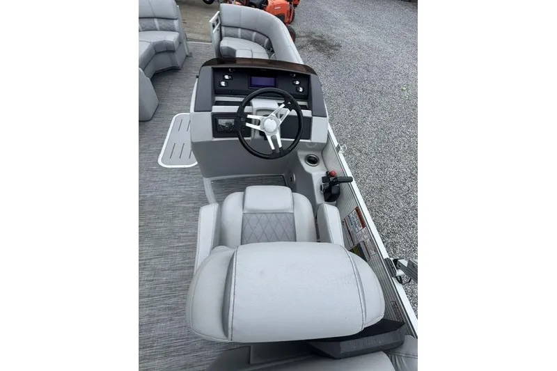 Slide: The Image of 2021 Bennington 24 LRSC boat interior with steering console and seating. - 7
