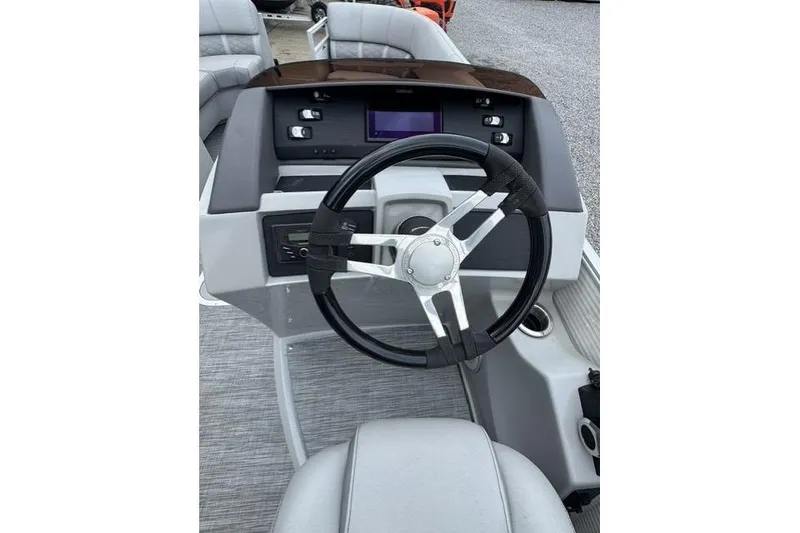 Slide: The Image of Steering console of a 2021 Bennington 24 LRSC boat with modern controls. - 8