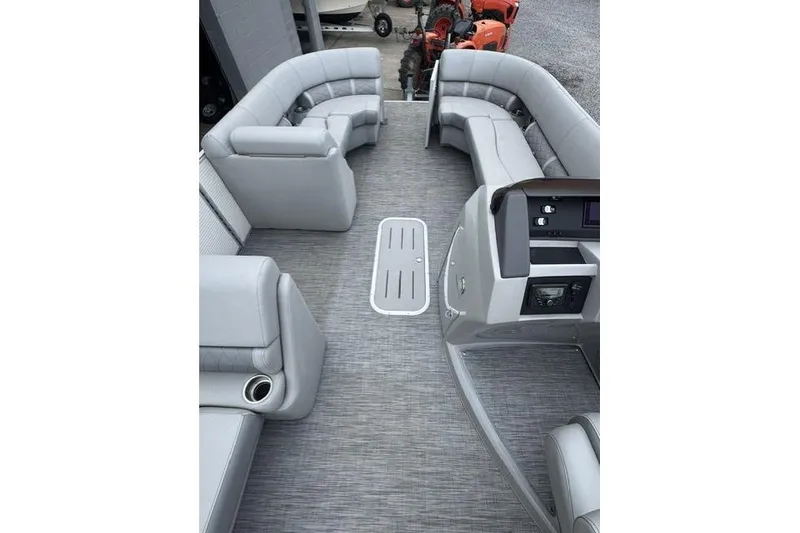 Slide: The Image of 2021 Bennington 24 LRSC pontoon boat interior with gray seating and modern dashboard. - 9